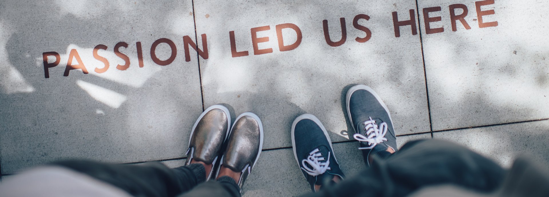 The phrase "Passion led us 在这里" is written on floor"